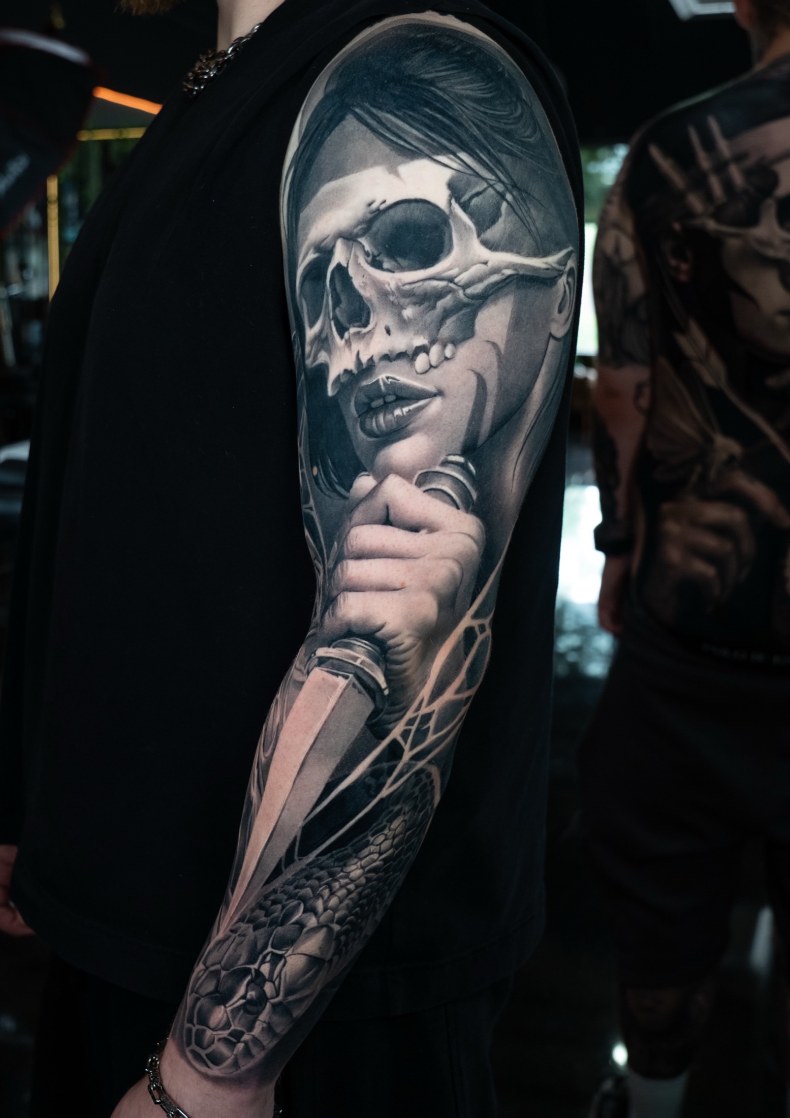 Finished dark realism knife and snake sleeve tattoo.