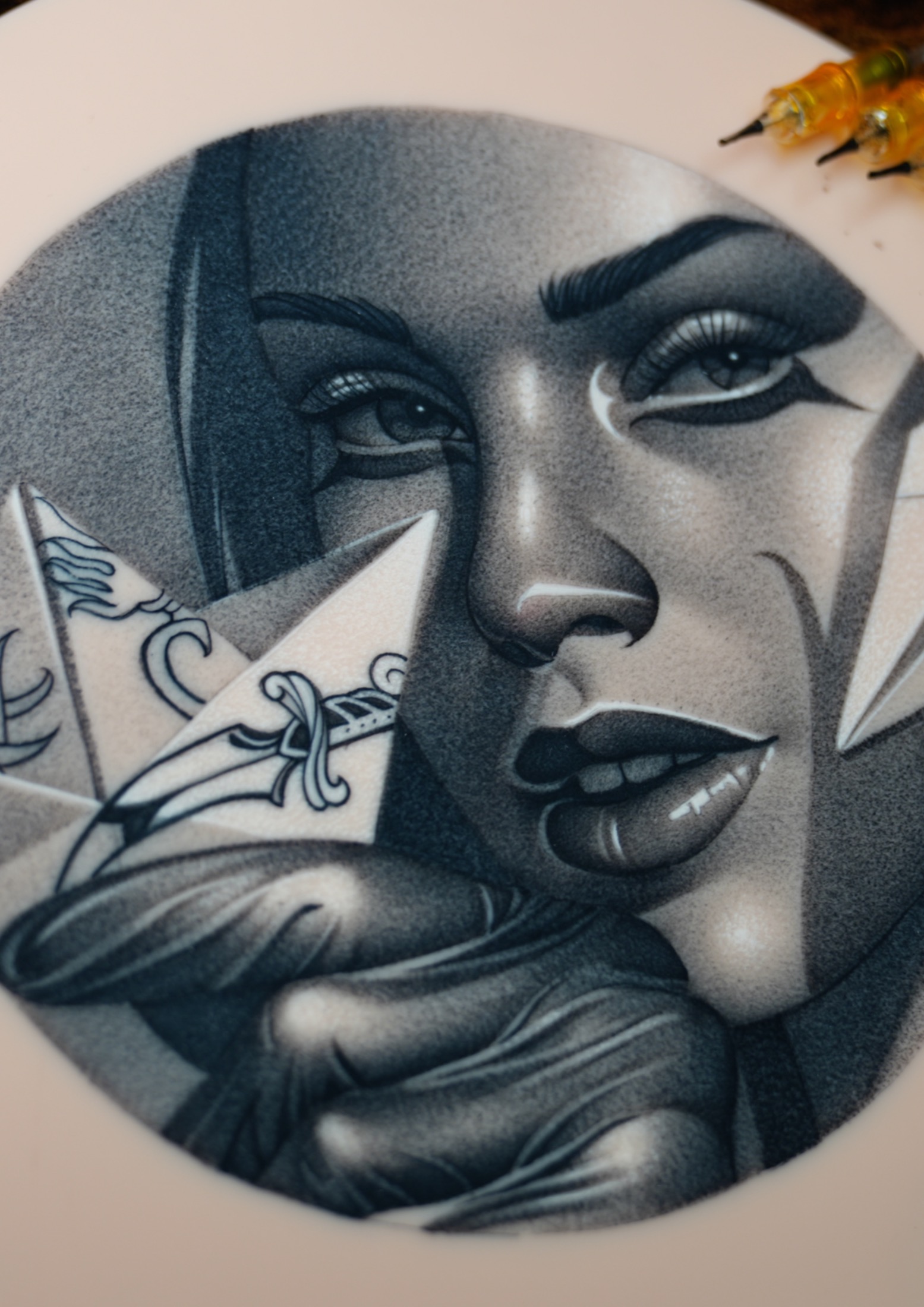 Finished dark realism paper plane portrait tattoo.