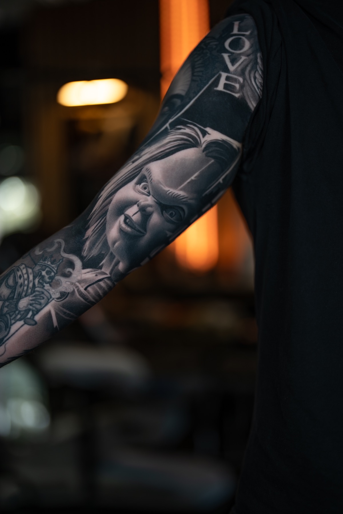 Dark realism arm detail tattoo by Fábio Guerreiro.