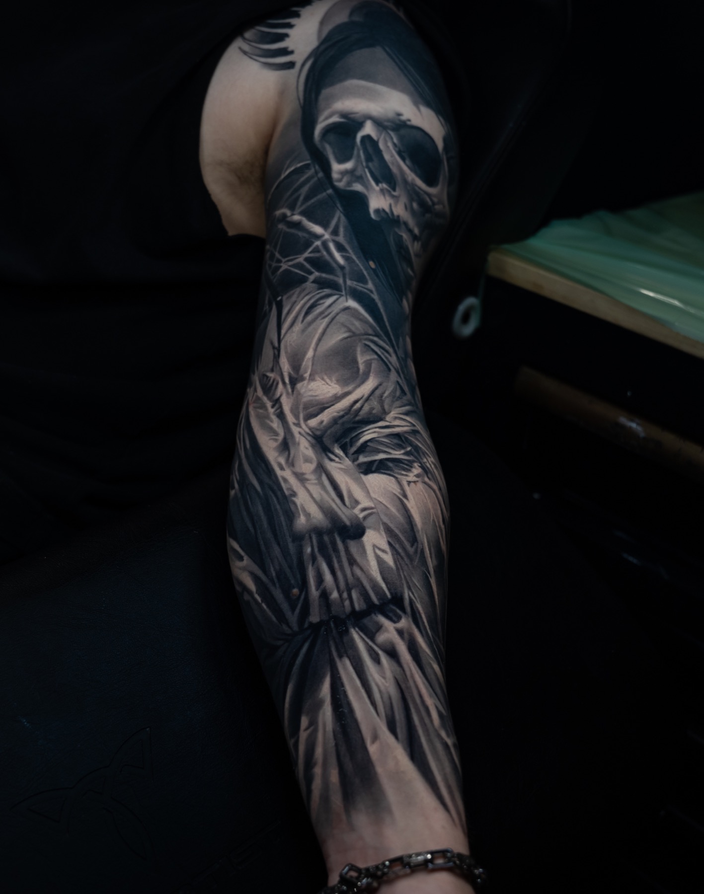 Dark realism sleeve tattoo by Fábio Guerreiro.