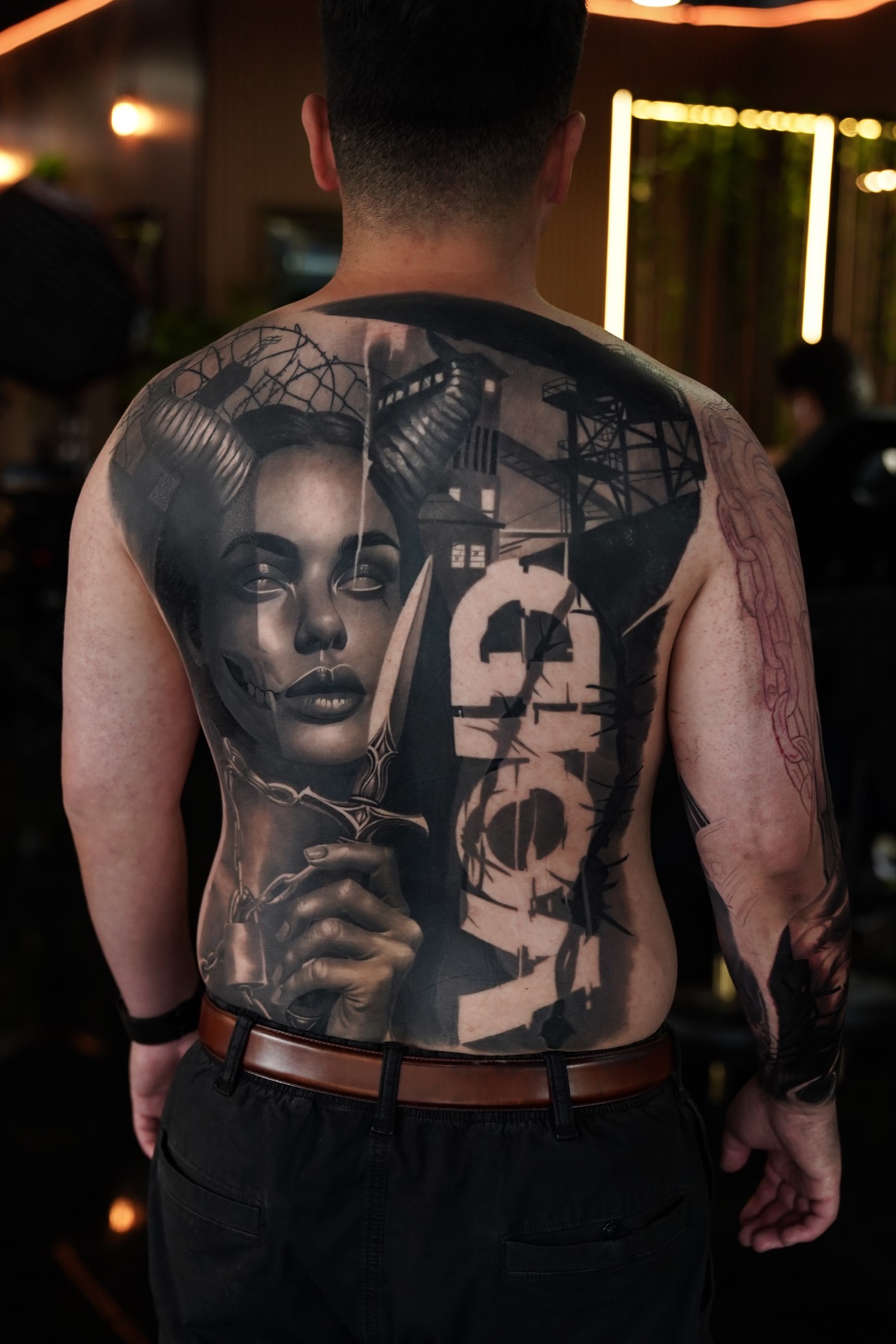 Finished large-scale back tattoo by Fábio Guerreiro.