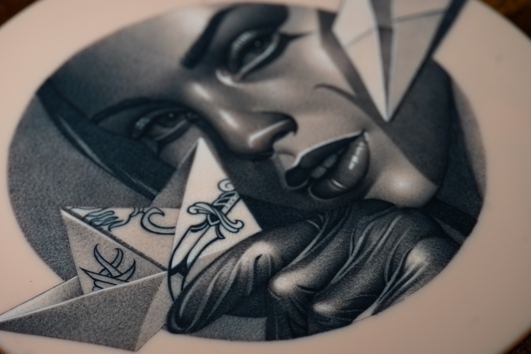 Black and grey upper arm tattoo by Fábio Guerreiro.