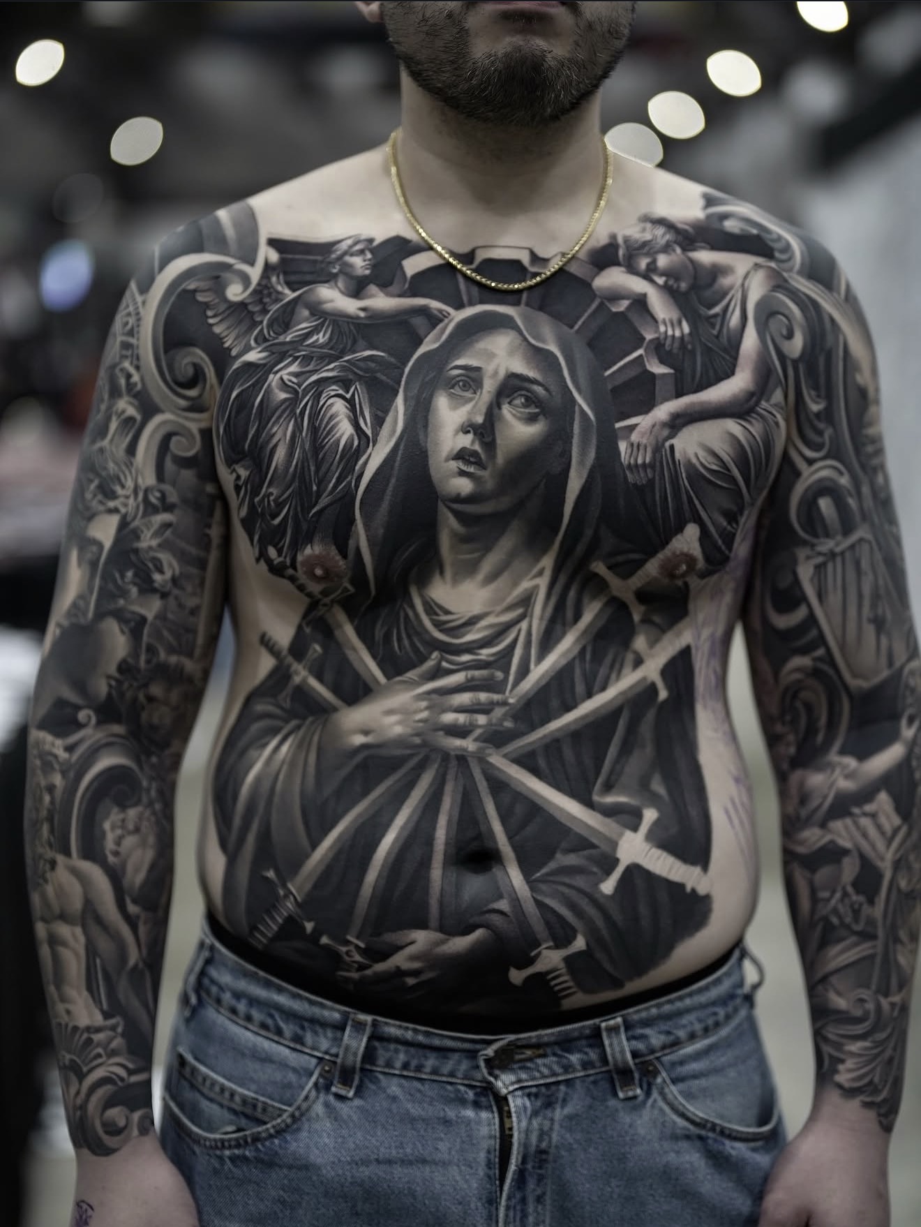 Black and grey front torso tattoo by Fábio Guerreiro.